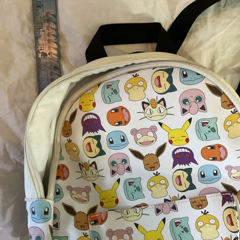 Pokemon‎ Pokeball Graphic Mini Backpack, Multi-Color  with chained zipper pouch.